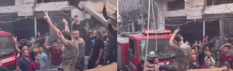 فلسطيني مصاب يرفع علامة النصر بعد إنقاذه من تحت ركام منزله المهدم في غارة إسرائيلية